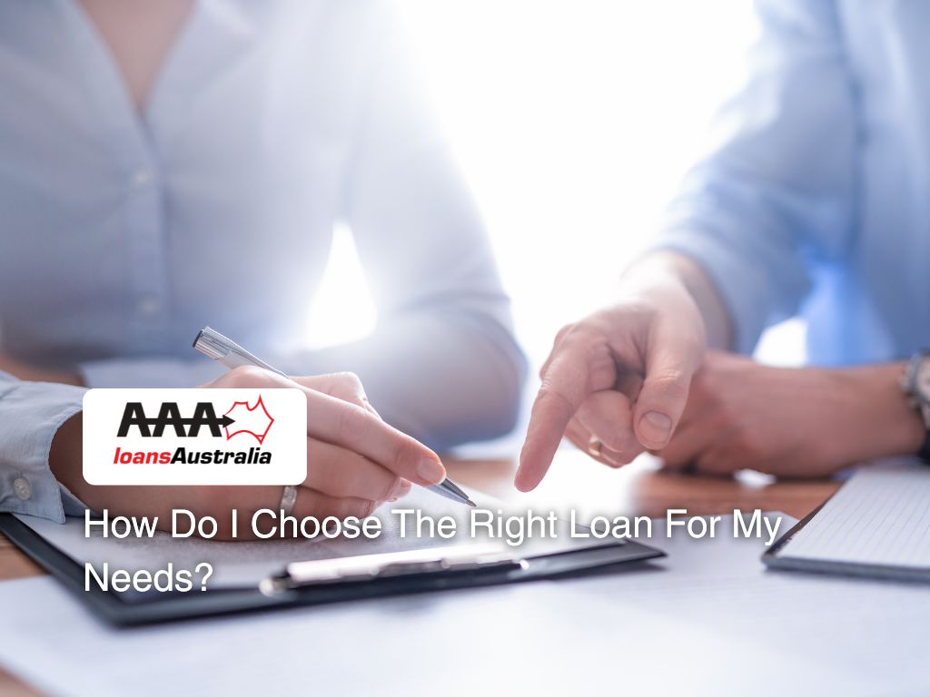 Two professionals discussing paperwork in an office, representing how to choose the right loan for individual financial needs.