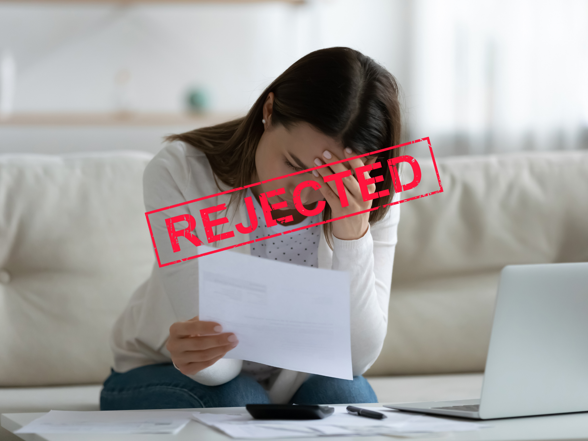 A woman receiving a rejection letter by the bank in Bundaberg