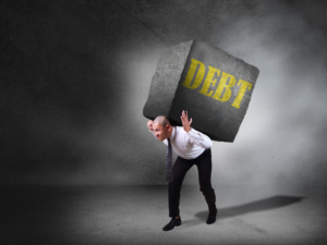A man carrying a boulder with "Debt" written on it.